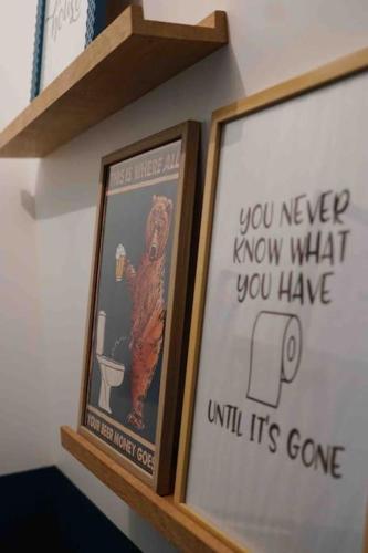 a couple of framed pictures on a shelf at Nawenn locations - maison du bonheur in La Landec