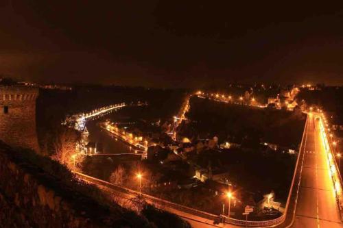 a view of a city at night with lights at Nawenn locations - maison du bonheur in La Landec