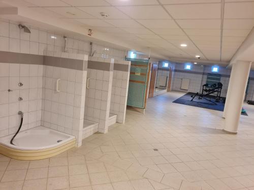 a bathroom with a shower and a toilet in a room at Hotel Bessunger Forst in Roßdorf