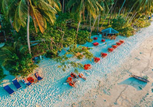 an aerial view of a beach with chairs and umbrellas at Sunset Colors in San Vicente