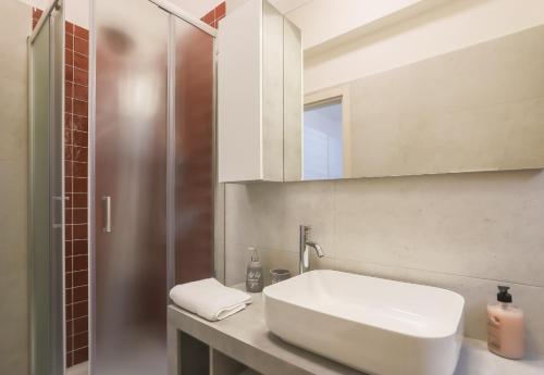 a bathroom with a white sink and a shower at BarbyB B&B in Salerno
