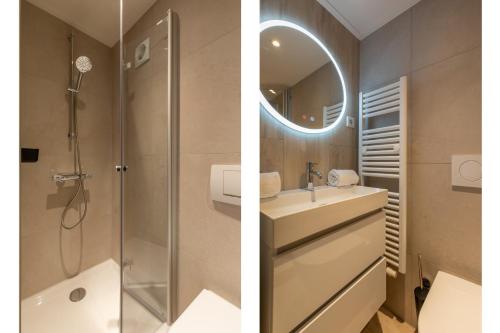 a bathroom with a shower and a sink and a mirror at Appartement - Nieuwstraat 1 - Zoutelande 'Kurhaus - 2' in Zoutelande