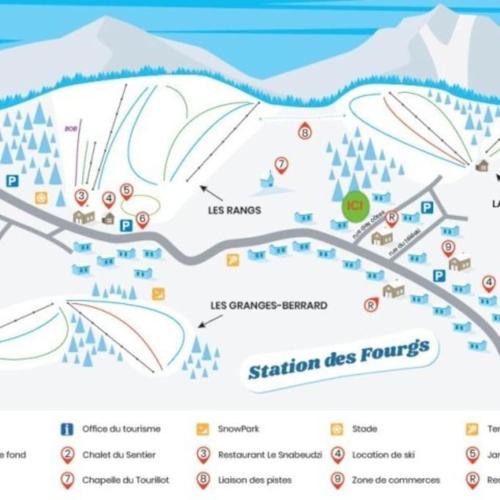 a map of a ski resort with mountains in the background at Appartement au pied des pistes in Les Fourgs