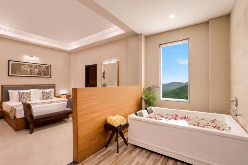 a room with a bath tub and a bedroom at Lemon Tree Resort, Kumbhalgarh in Kumbhalgarh
