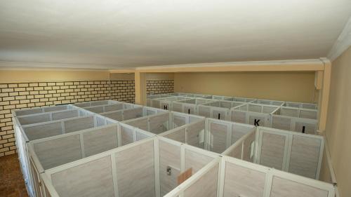 a room filled with lots of empty shelves at Hostel Mandaria in Kutaisi