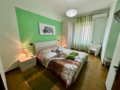 Postel nebo postele na pokoji v ubytování L'OLIVO DI EVELINA