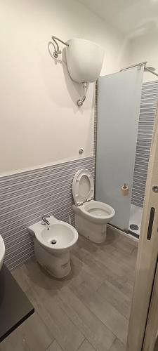 a bathroom with a toilet and a bidet at Casa di Nonna Margherita in Trecase