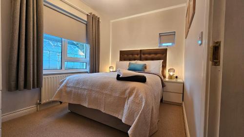 Ένα ή περισσότερα κρεβάτια σε δωμάτιο στο Cherrymount Cottage