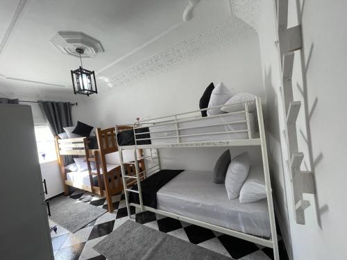 a bedroom with two bunk beds in a room at Casa Marwan in Tetouan