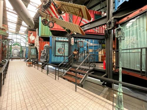 a train station with many different types of trains at Nights in A Box in Ban Muang (1)