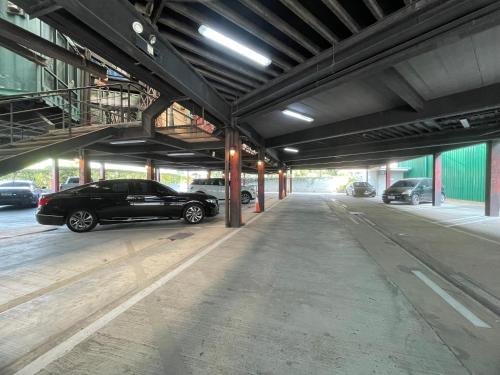 a car parked inside of a parking garage at Nights in A Box in Ban Muang (1)