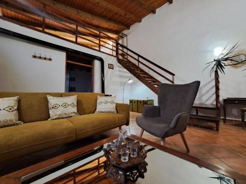 a living room with a couch and a chair at Villa Nama in Kissamos