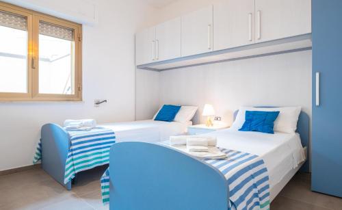 Postel nebo postele na pokoji v ubytování Apartment Mikao 4 e 5