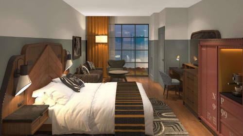 1 dormitorio con 1 cama grande y sala de estar en Hotel Nickel Plate Fishers, Tapestry Collection By Hilton, en Fishers