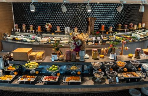a buffet with various food items on display at Hilton Istanbul Kozyatagi in Istanbul