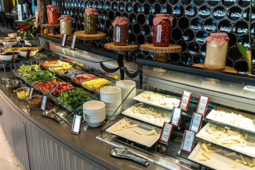 a buffet line with a lot of food on display at Hilton Istanbul Kozyatagi in Istanbul