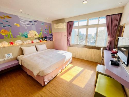 Postel nebo postele na pokoji v ubytování 南天海旅店
