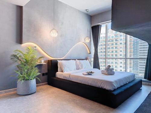 a bedroom with a bed with a teddy bear on it at Key View - Hub Canal 1 in Dubai