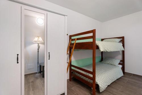 Postel nebo postele na pokoji v ubytování Sweet Home Apartments Bambù