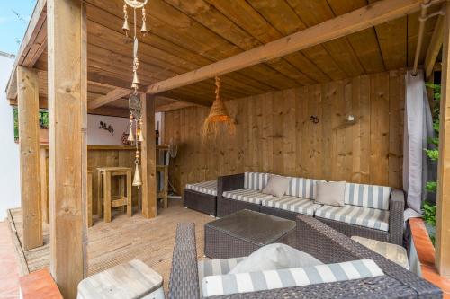 a living room with a couch and a table at Siempre Verde in Alcaucín