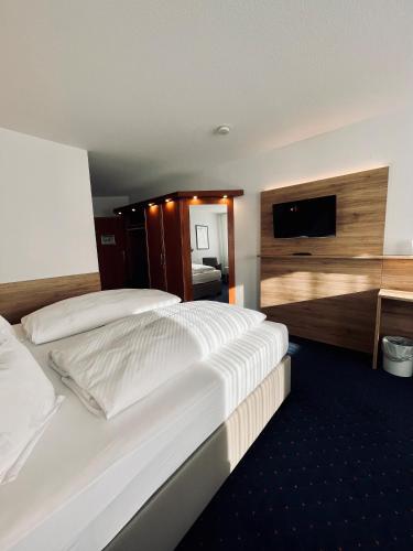 Postel nebo postele na pokoji v ubytování Hotel-Restaurant Zum Schwanen