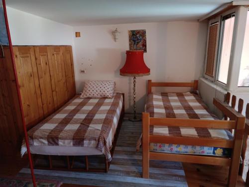 Ένα ή περισσότερα κρεβάτια σε δωμάτιο στο Maravilja 23
