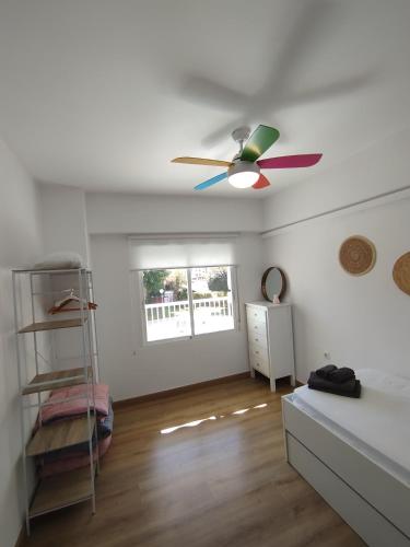 Ένα ή περισσότερα κρεβάτια σε δωμάτιο στο Apartamento Huellas en la Arena