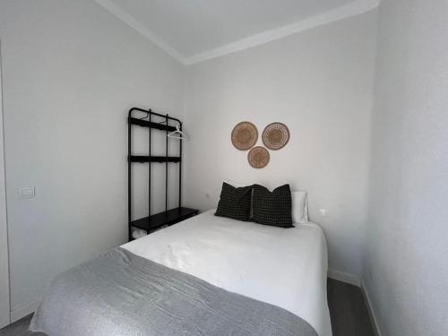 Ένα ή περισσότερα κρεβάτια σε δωμάτιο στο Cosy flat Arganzuela - AC