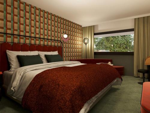 Postel nebo postele na pokoji v ubytování The Home Hotel Zürich - a member of DESIGN HOTELS