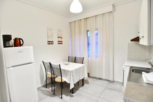 A kitchen or kitchenette at Luca Apartments