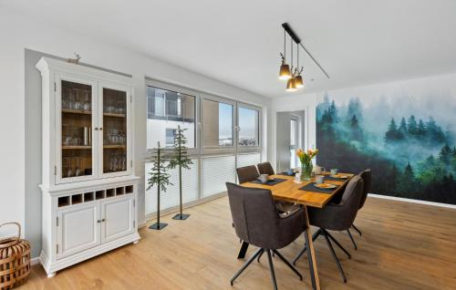 a dining room with a table and chairs at Gebirgsresort Winterberg in Winterberg