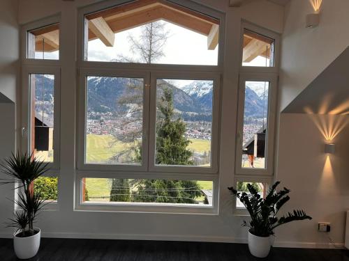 a large window with a view of a mountain at In der Leite in Oberstdorf