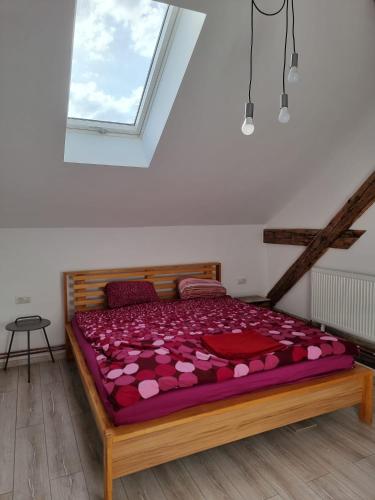 a bedroom with a large bed with hearts on it at Apartament spatios in centru in Oradea