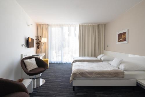 Postel nebo postele na pokoji v ubytování Fabrika Hotel