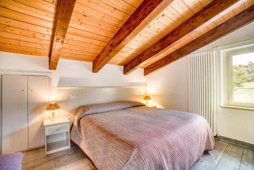 Ένα ή περισσότερα κρεβάτια σε δωμάτιο στο Casavacanzelemore - Casa Zara