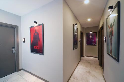 a hallway with paintings on the walls of a building at Meet İstanbul Hotel Kadikoy in Istanbul