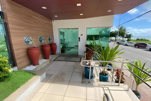 a house with plants on the side of it at Luxor Paulo Miranda by Allmare Temporada in João Pessoa