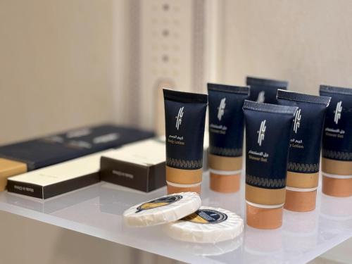 a table with a bunch of products on it at فندق أبراج الريان المكية Al Rayyan Makiya Towers Hotel 1 in Makkah