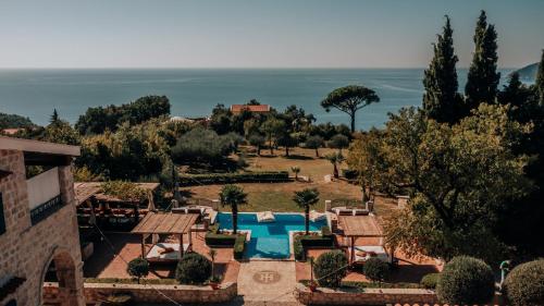 an aerial view of a resort with a swimming pool at Talići Hill - Rustic Villas in Sutomore