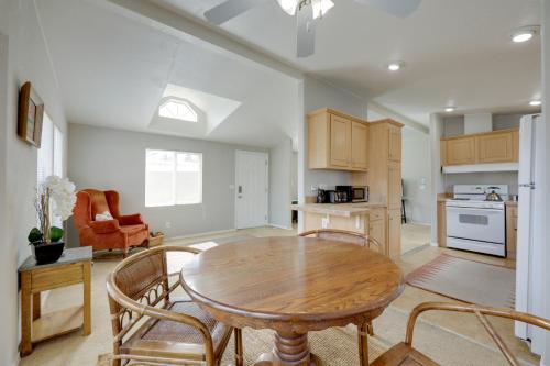 a kitchen with a wooden table and chairs in a room at Oak View Home - Close to Beaches and Trails! in Oak View