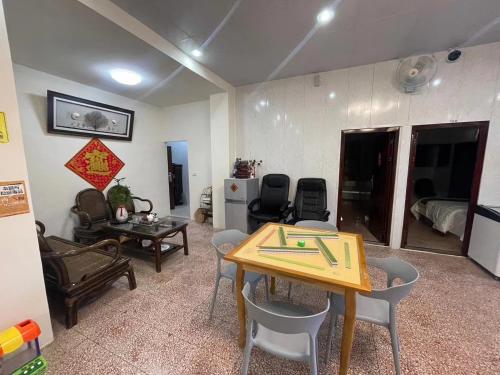 a living room with a table and chairs at Secret Homestay in Yuchi