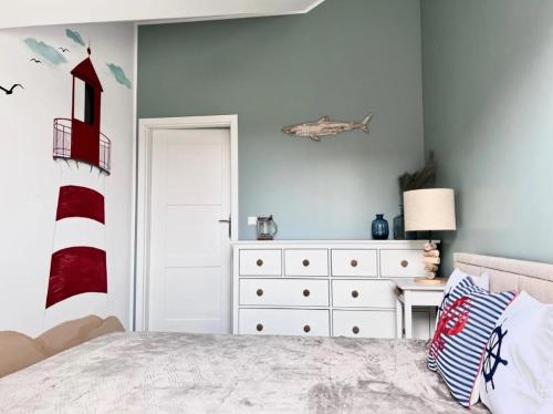 Ένα ή περισσότερα κρεβάτια σε δωμάτιο στο Apartament Łeba Piaskowa Ostoja