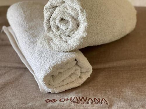 a roll of white towels sitting on a table at QHAWANA CABAÑAS & SUITES in La Rioja