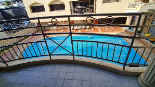 a bridge over a swimming pool in a building at Baan Arthit Thong Lo Ekkamai Prompong in Khlong Toei