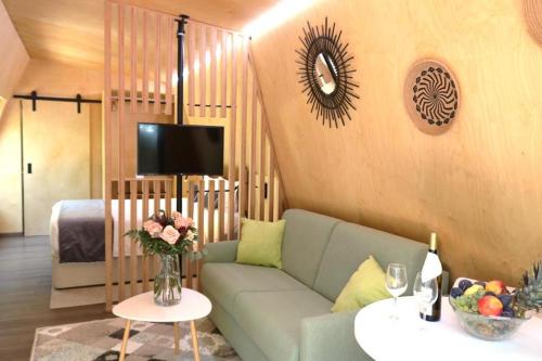 a living room with a couch and a bed at Fazenda Viegas in Lagos