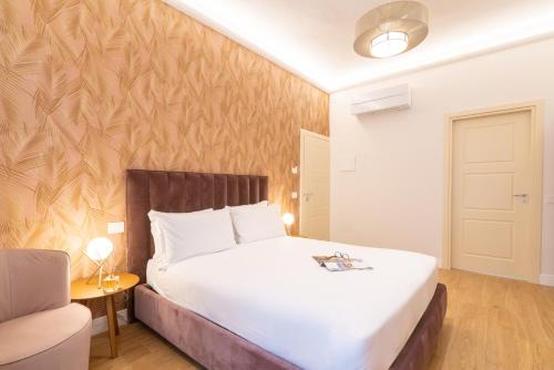 Postel nebo postele na pokoji v ubytování Hotel Ginori Al Duomo