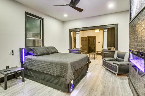 a bedroom with a bed and a couch and a chair at New Orleans Duplex 2 Mi to Bourbon Street! in New Orleans