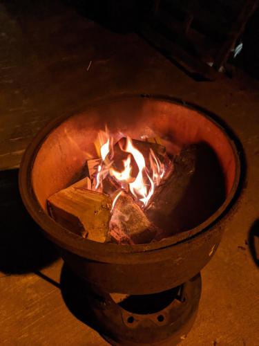 a pot with a fire inside of it at Killynick Glamping Oiney Fishing County Fermanagh in Enniskillen