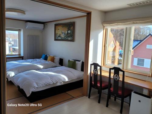 Postel nebo postele na pokoji v ubytování Hokkaido Hakodate Onuma National Park Kenzo's House