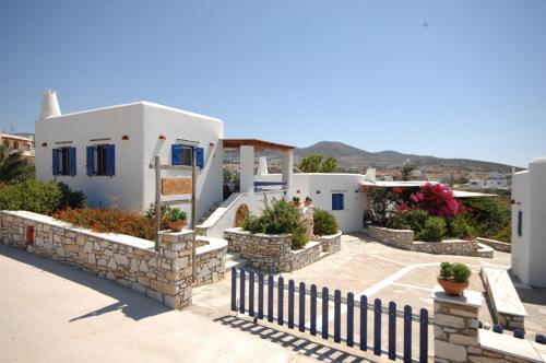 a view of a house with a fence at Maria's Village Two Bedroom House 5 in Aliki